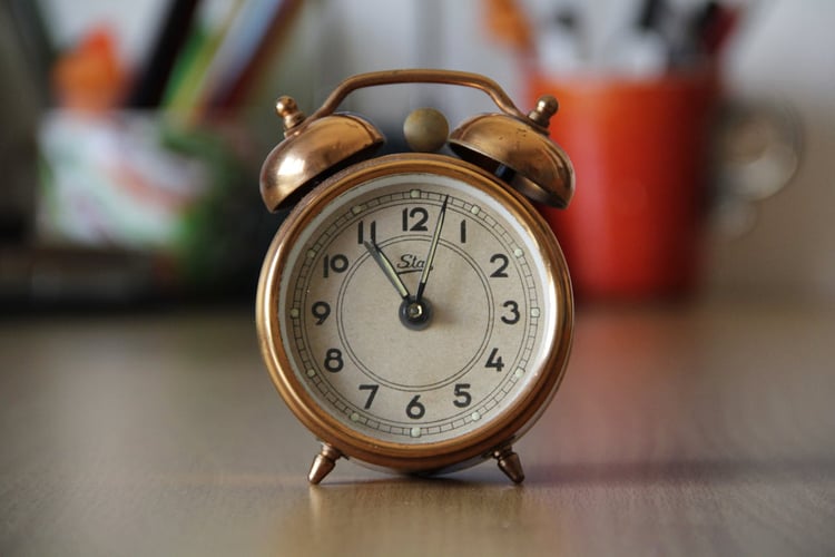 A old small brown alarm clock